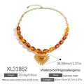 Gold stainless steel necklace with amber oval beads and sunburst heart charm - Beaded Heart Sunburst Style (XL31862)