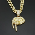 Macro shot of iced out dripping lips pendant on a thick gold cuban link hip hop chain - Gold Pendant with 50CM Iced Cuban Chain