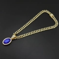 Dettaglio della catena cubana hip-hop con pendente ovale blu e micro cristalli incastonati - Pendolo Zaffiro Con Catena Cubana
