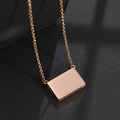 Minimalist rose gold rectangular pendant necklace with smooth mirror finish on black background - Slide Envelope / Rose Gold