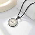 Macro detail of black matte Jesus pendant with Greek fret patterns and box chain - Black JESUS Box Pearl Necklace / Black