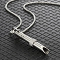 Close-up of polished titanium steel mindfulness whistle pendant with frosted center bead - Steel Bamboo Joint Style