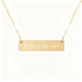 Detailed shot of gold bar necklace engraved with trust in the lord message - Trust in the Lord Style