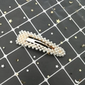 Detail of elegant rectangular hair clip with white faux pearls on golden base - Rounded Waterdrop Style (C2105) / Gold