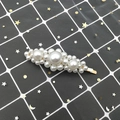 Macro detail of elegant oval hair clip featuring white pearls on a gold metal base - Straight Large Pearl Style (C2107) / Gold