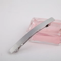 Minimalist rectangular metal spring hair clip in matte silver with a brushed finish texture - Silver