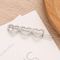 Fermaglio per capelli a cuore argento lucido con tre cuori cavi per acconciature donna - Argento
