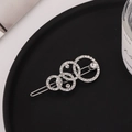Macro detail of silver hair clip featuring overlapping circles with crystals and pearls - Rhinestone Style (C3415) / Silver Rhinestone Style (C3415)
