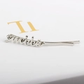 Minimalist silver alloy hair clip featuring a 3D Smile letter charm with metallic finish - Silver Smile
