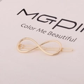 Macro shot of gold infinity hair clip on elegant white card background decoration - Infinity Shape (F3306) / Gold