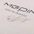 Macro detail of silver alloy infinity symbol hair clip on minimalist display card - Infinity Shape (F3307) / Silver