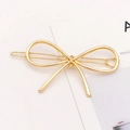 Elegant gold-plated alloy hair clip featuring a geometric ribbon bow design on white background - Bow Shape (F2105) / Gold