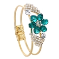 Detail view of the green crystal plum blossom flower and rhinestone gold double ring - Dark Green