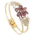 Close-up of golden double-layer bracelet featuring purple crystal plum blossom and rhinestones - Purplish Red