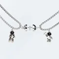 Magnetic astronaut couple necklaces with matching heart pendants in silver finish - Star Catching and Holding Round Magnet Pair (NST-0310)