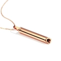 Detailed view of the rose gold cylinder pendant showing the polished hollow whistle design - Rose Gold Cross Chain