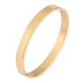 Close-up of golden stainless steel bangle with engraved Roman numerals from I to XII - Bangle / 6mm / Roman Numeral Bracelet Gold