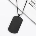 Detail of matte black stainless steel dog tag necklace with matching bead chain on white - Black
