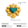 Golden stainless steel heart pendant featuring a central green gemstone and sunburst texture - Emerald Glossy Heart Radial Charm (PJ92668C)