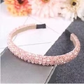 Elegant beaded headband featuring pink crystal beads and comfortable black protective ends - Pink
