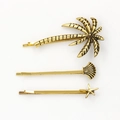 Juego de tres pinzas para el cabello doradas con palmeras conchas y estrellas de mar - Dorado (B6103)