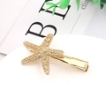 Close-up of a golden starfish hair clip with detailed texture and alligator clip back - Gold (B5221)