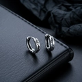 Silver hoop earrings for men and women featuring black engraved heartbeat patterns - Silver