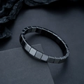 Macro view showing polished square hematite beads with metallic mirror finish for men - Glossy Black Rounded Square Style (S528-B)