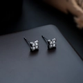 Elegant four-leaf clover stud earrings with black metal base and sparkling clear zircons - Gunmetal