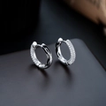 Detail of silver huggie earrings with pavé white zircons and black wave enamel finish - Black Earrings (X1091-C)