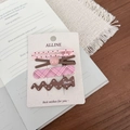 Detail of 4-piece hair clip set with pink and coffee tones on white display card - Pink Bead Coffee Wave