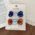Süßes Hunde-Haarspangen-Set in Blau und Bernstein auf einer Displaykarte für Haare - Strass Knochen Cartoon Hund Clips
