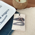 Detail of sweet duckbill hair clips with check pattern and Fancy text on display card - Bow Gray Twill Polka Dot BB Clip