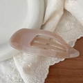 Detail view of hollow 11.5cm light brown hair claw clip on elegant lace backdrop - Light Nude Pink