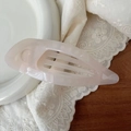 Detail of elegant 11.5cm hollow leaf hair claw clip in translucent pink acetate material - Jelly White