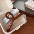 Detailed close-up of amber resin hair claw clip with golden spring in a gift box - Hanger Claw Clip / approx. 14.5cm