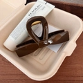 Detailed close-up of dark brown glossy bow hair claw clip with golden metal spring - Beech Brown - Straight Bow Hair Claw (10.5cm)