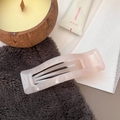 Detail of a light pink rectangular hair claw clip with a marble acrylic resin texture - Jelly White