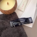Detail of deep purple rectangular hair claw clip with translucent finish and hollow design - Haze Blue