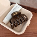 Elegant large brown hollow hair claw clip with golden spring on dark wood background - Beech Brown - Pumpkin Hair Claw