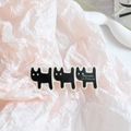 Detail van drie zwarte katten op een haarklem met de gouden tekst Barrette La France - Zwarte Hond-H2 (6cm)