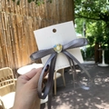 Y2K grey lace bow hair clip with heart gem decoration on white card display - Gray Bow Ribbon / Gray