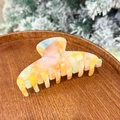 Detail view of large colorful acetate hair claw clip with iridescent marble texture - Multicolor Pink Yellow (10.5cm)