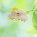 Close-up of white cloud hair claw clip with yellow sun detail and smiley face design - Cloudy Baby with Sun