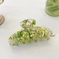 Detail showing translucent floral acetate hair claw clip with lime green and yellow patterns - Large / Mint Green