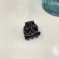 Detail of small black acetate hair claw with white polka dots and gold wavy line patterns - Black (Small)