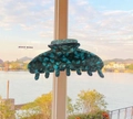Detail of teal acetic acid hair claw clip with tortoiseshell texture and polished finish - Approx 10.5cm / Blue Sea Dream