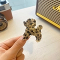 Detailed close-up of a poodle-shaped acetate claw clip in classic tortoiseshell pattern - Light Tortoiseshell (Light Tortoiseshell Dog)