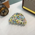 Detalle de una pinza para el pelo de acetato con patrones abstractos de grafiti coloridos - Garra Mediana (Aprox 7cm) / Graffiti de Cómic