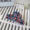 Large acetate hair claw clip with blue and pink abstract texture in a wavy shark design - 10.5cm / Black With Blue Red Contrast
